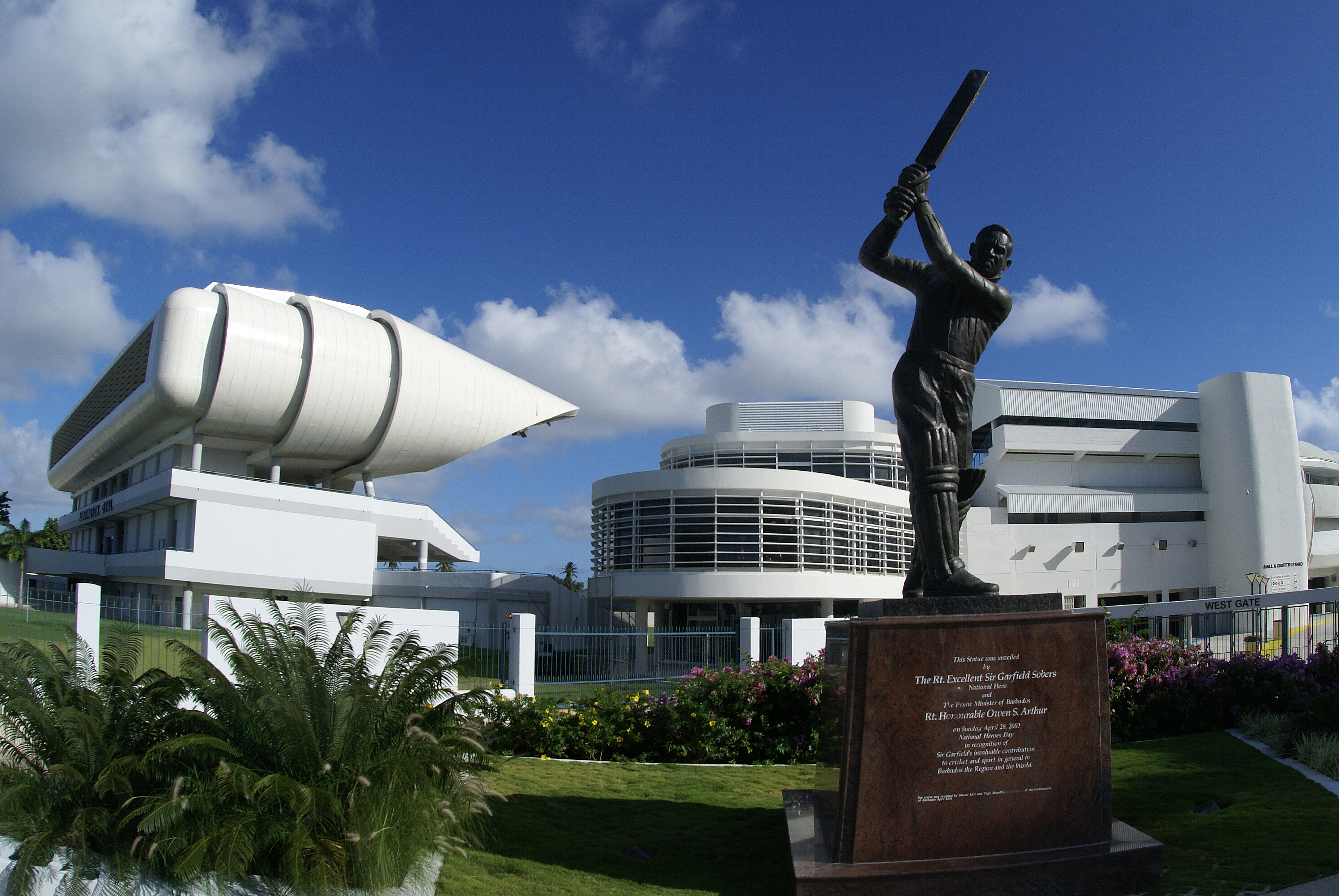 A statue of Sir Garry Sobers stands infront of the Kensington Oval where cricket fans can take a daily tour of this famous sporting venue.