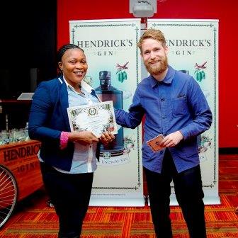 A bartender receives a certificate from Ally Martin of Hendricks during a spirits training day hosted by the world-famous gin.